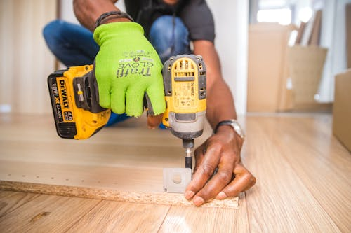 Contractor using a drill