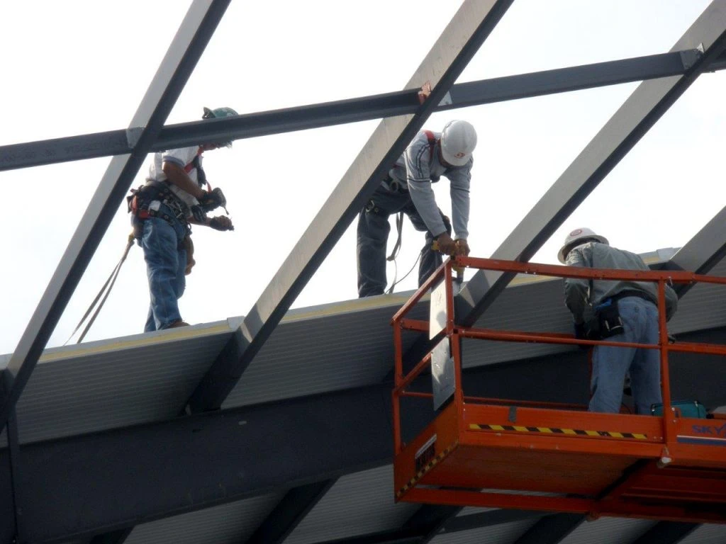 professional builder installing a metal shed